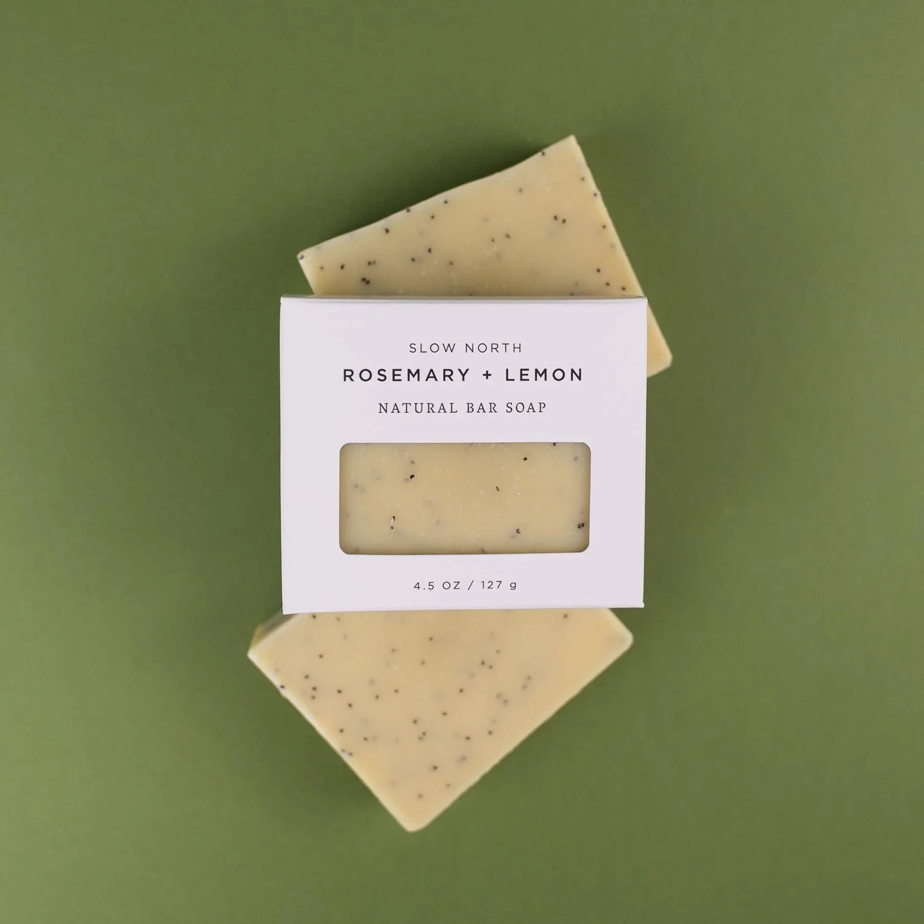 Rosemary and lemon natural bar soap by Slow North on green background