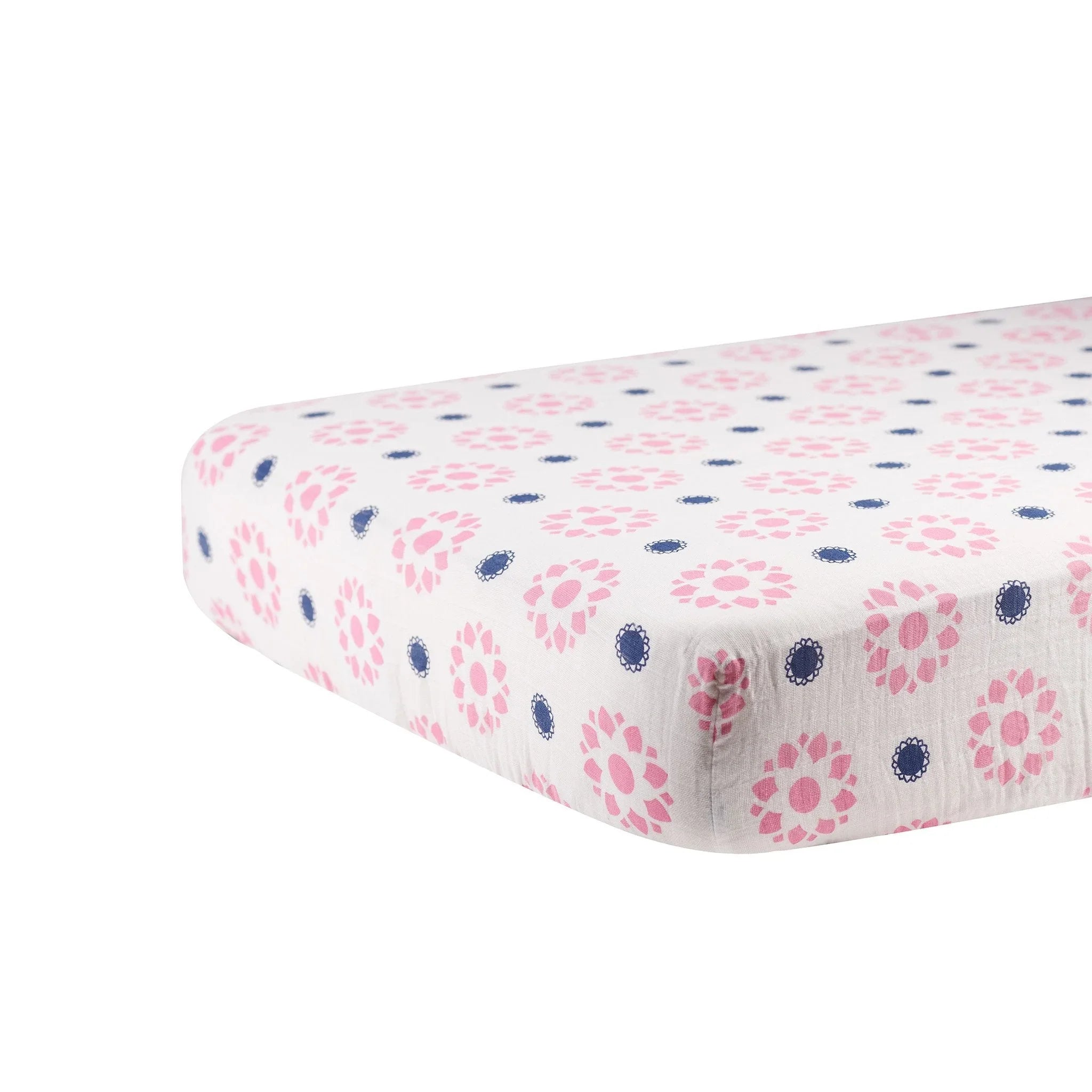 Cotton crib sheet with pink and indigo floral pattern, artist-designed from Qu!rk Boutique