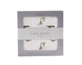 Newcastle Classics cotton crib sheet with cute green dinosaur print in gift box packaging.