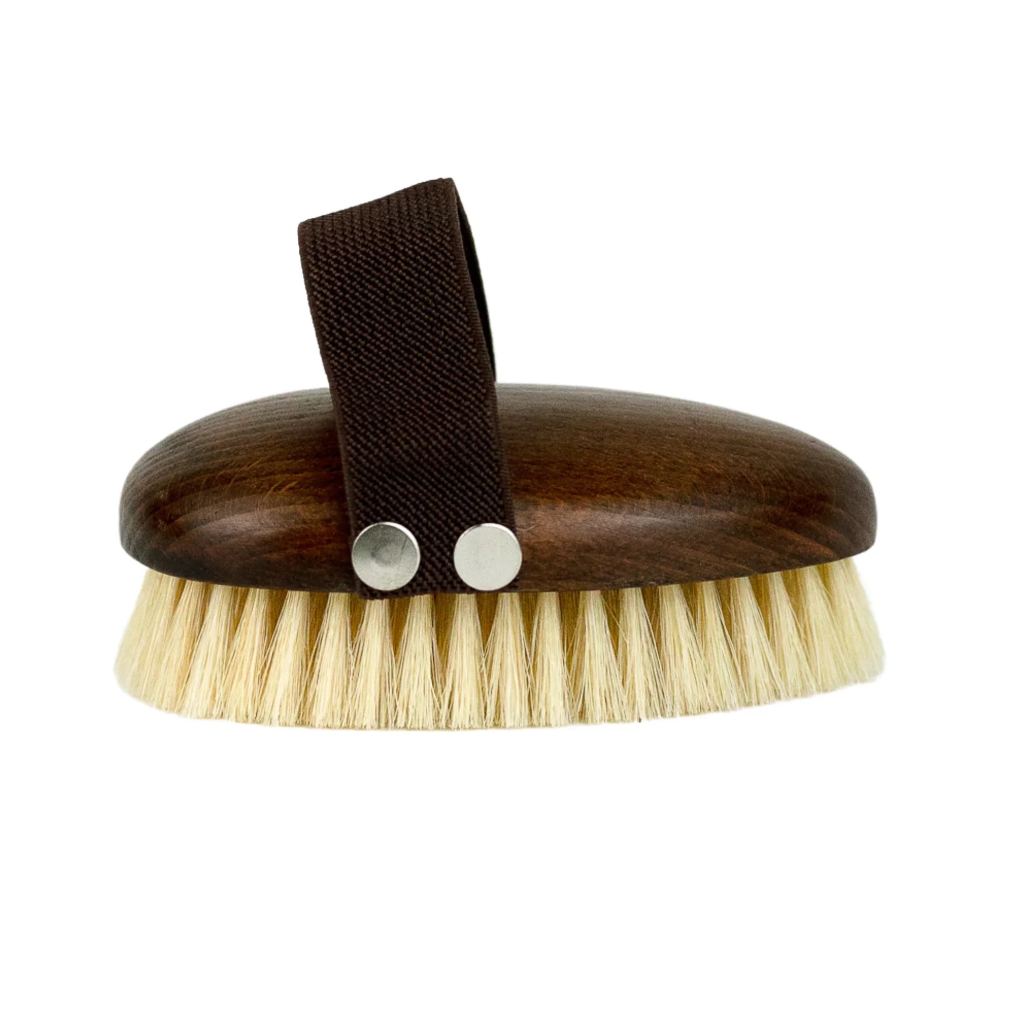 Oval wooden body dry brush with light bristles and dark fabric strap for hand grip