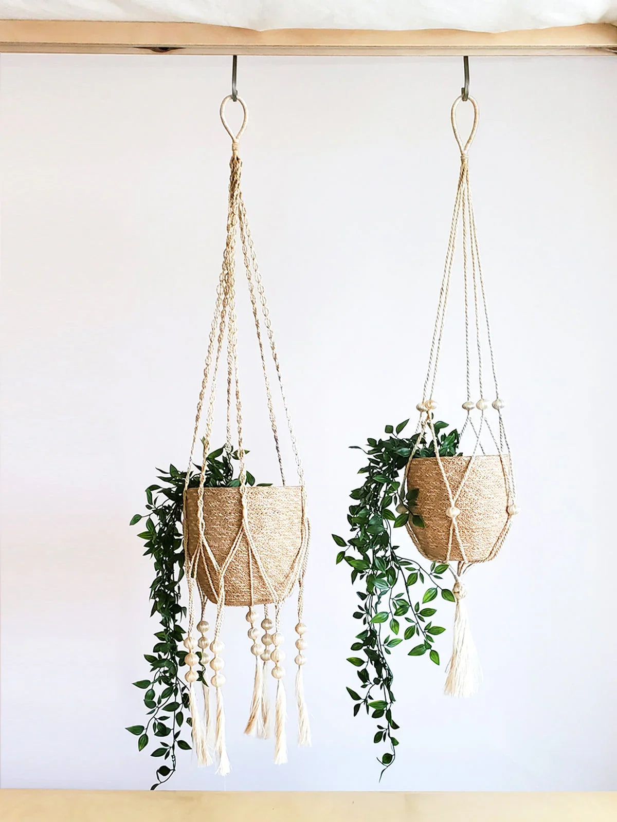 Macrame plant hangers with faux greenery in natural woven baskets, eco-friendly home décor