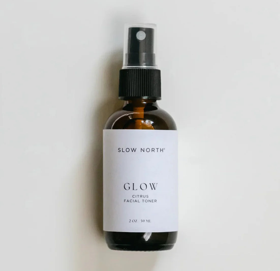 Slow North Glow citrus facial toner in a 2 oz amber glass spray bottle with white label