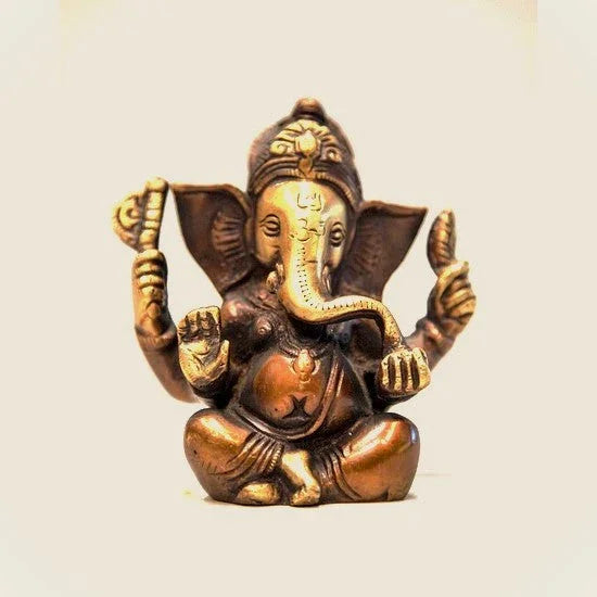 Bronze sitting Ganesha statue with intricate details, featured at Qu!rk Boutique & Gift Shop