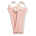 Pink patterned Slow North heated neck wrap with handles on white background