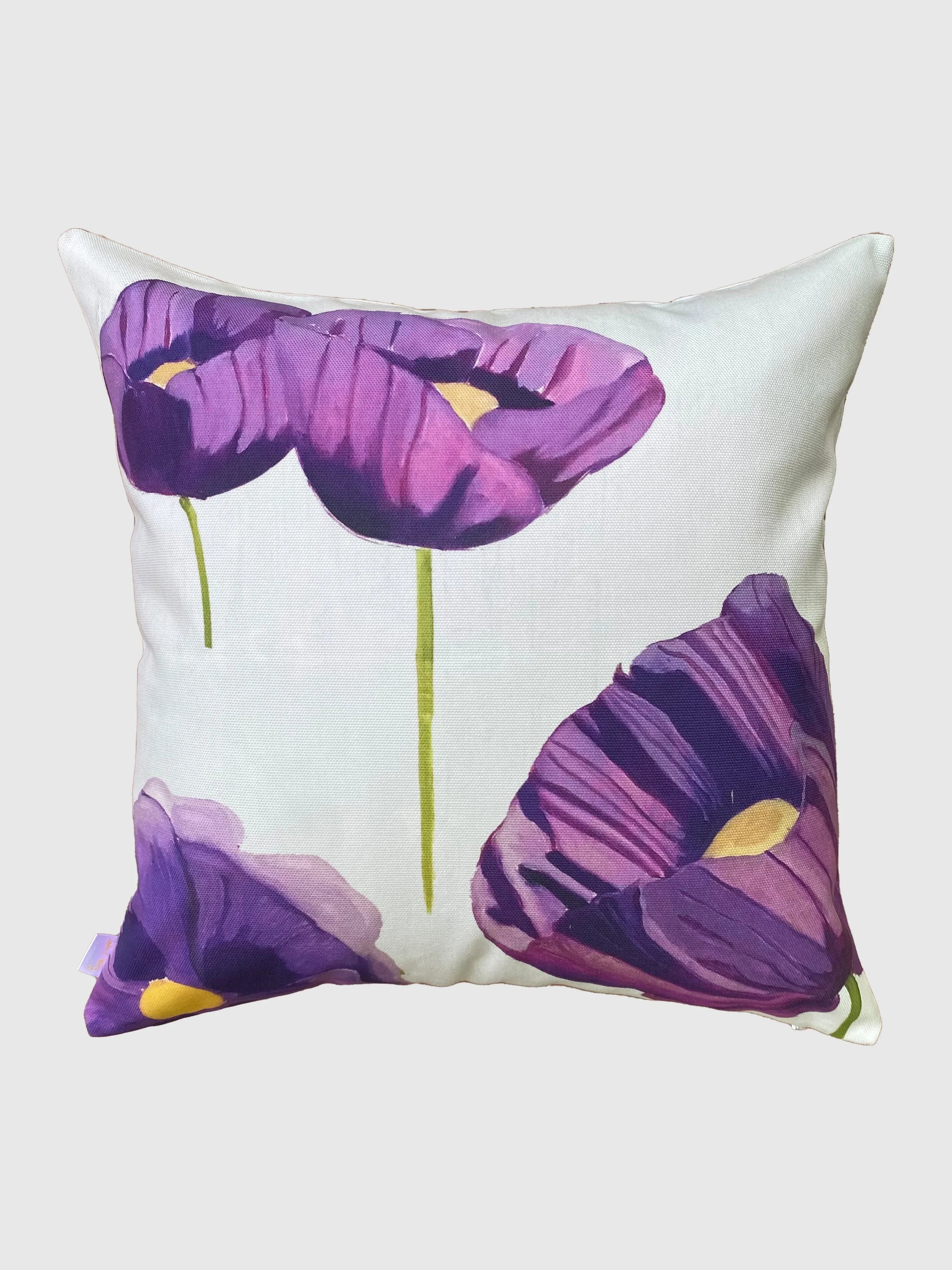 White throw pillow with large purple poppies and green stems floral design