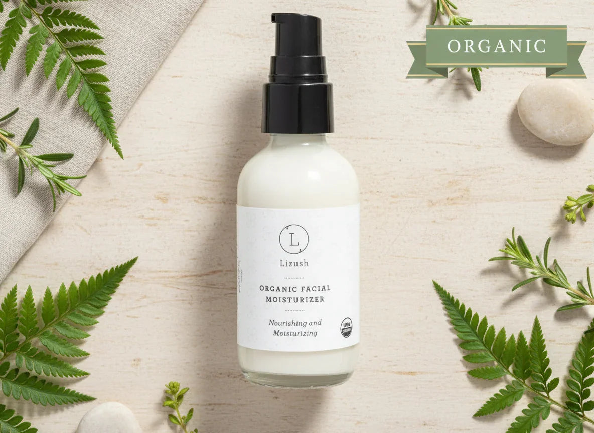 Lizush organic facial moisturizer bottle on natural background with green leaves and stones