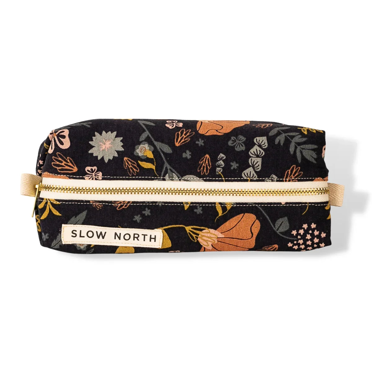 Slow North travel pouch with Canyon Springs floral pattern and beige zipper on white background