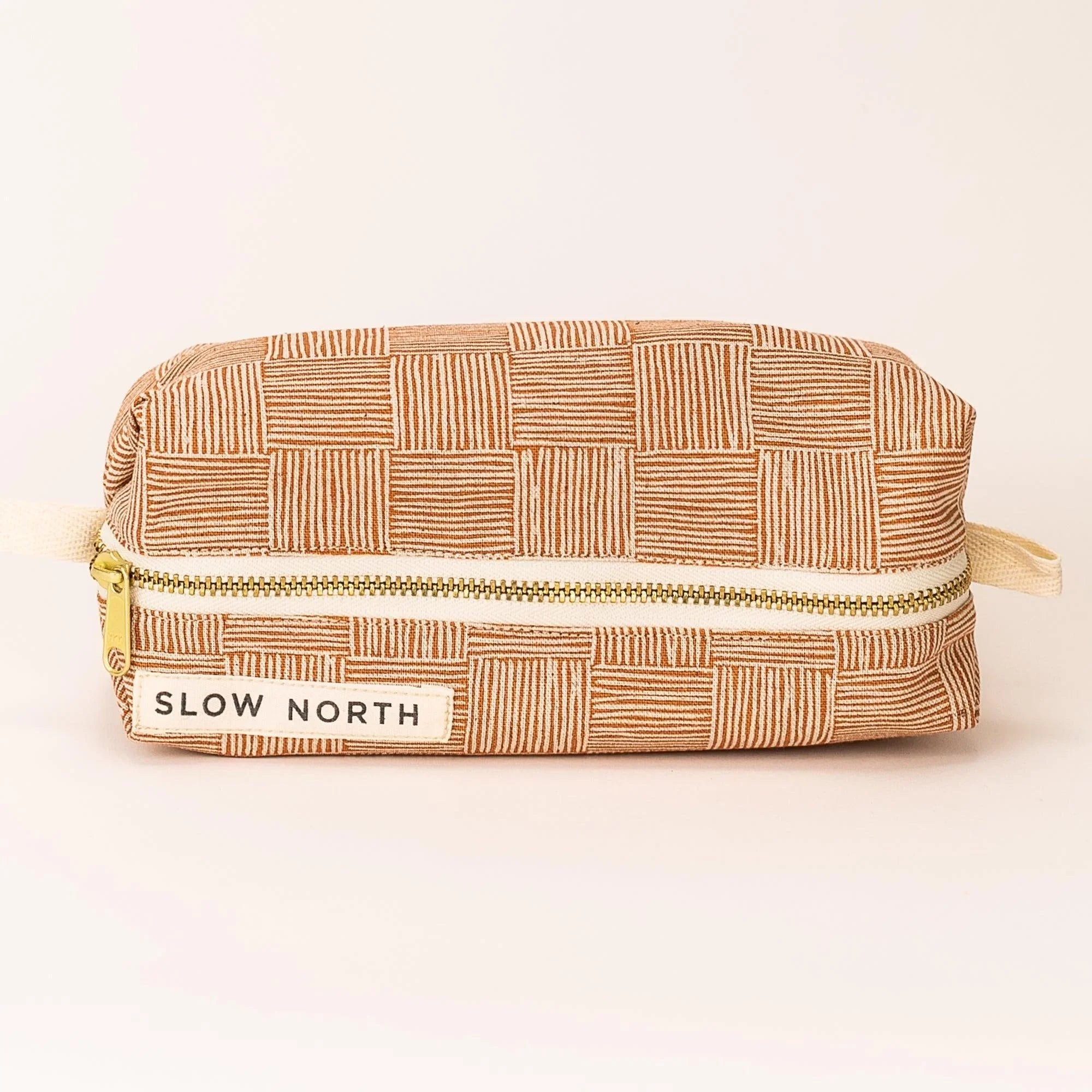 Slow North copper patterned travel pouch with zipper, eco-friendly accessory at Qu!rk Boutique