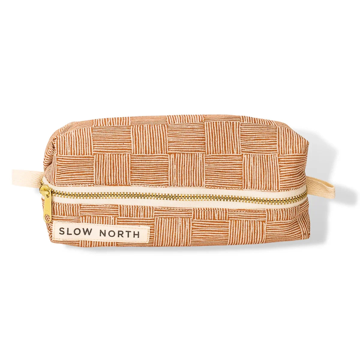 Artist-designed copper travel pouch with geometric pattern and gold zipper, Slow North label
