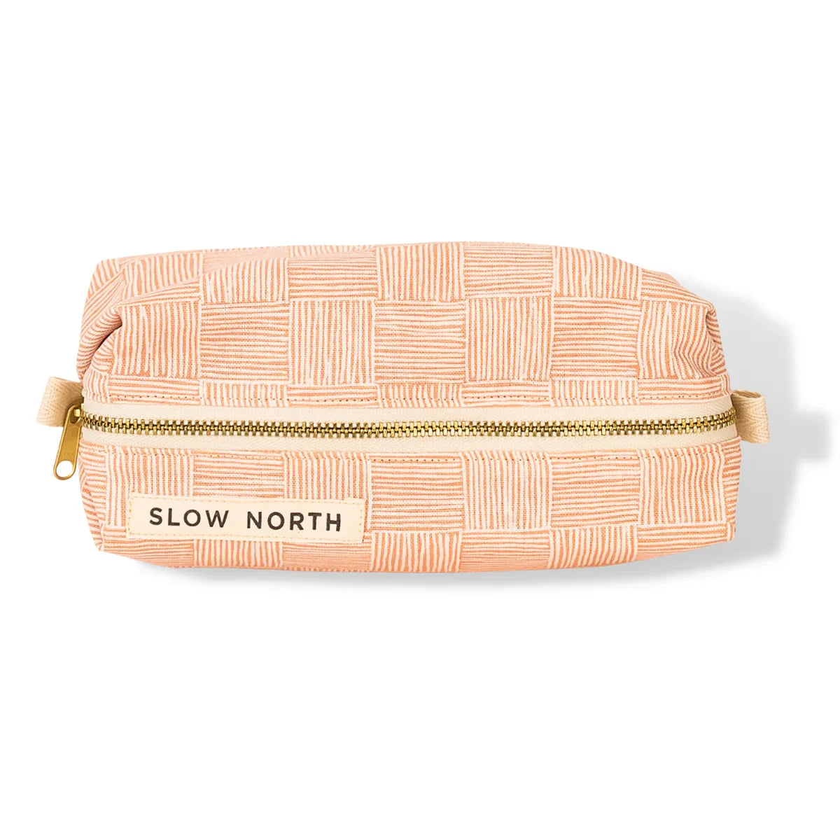 Pink pampas patterned rectangular travel pouch with gold zipper and Slow North label