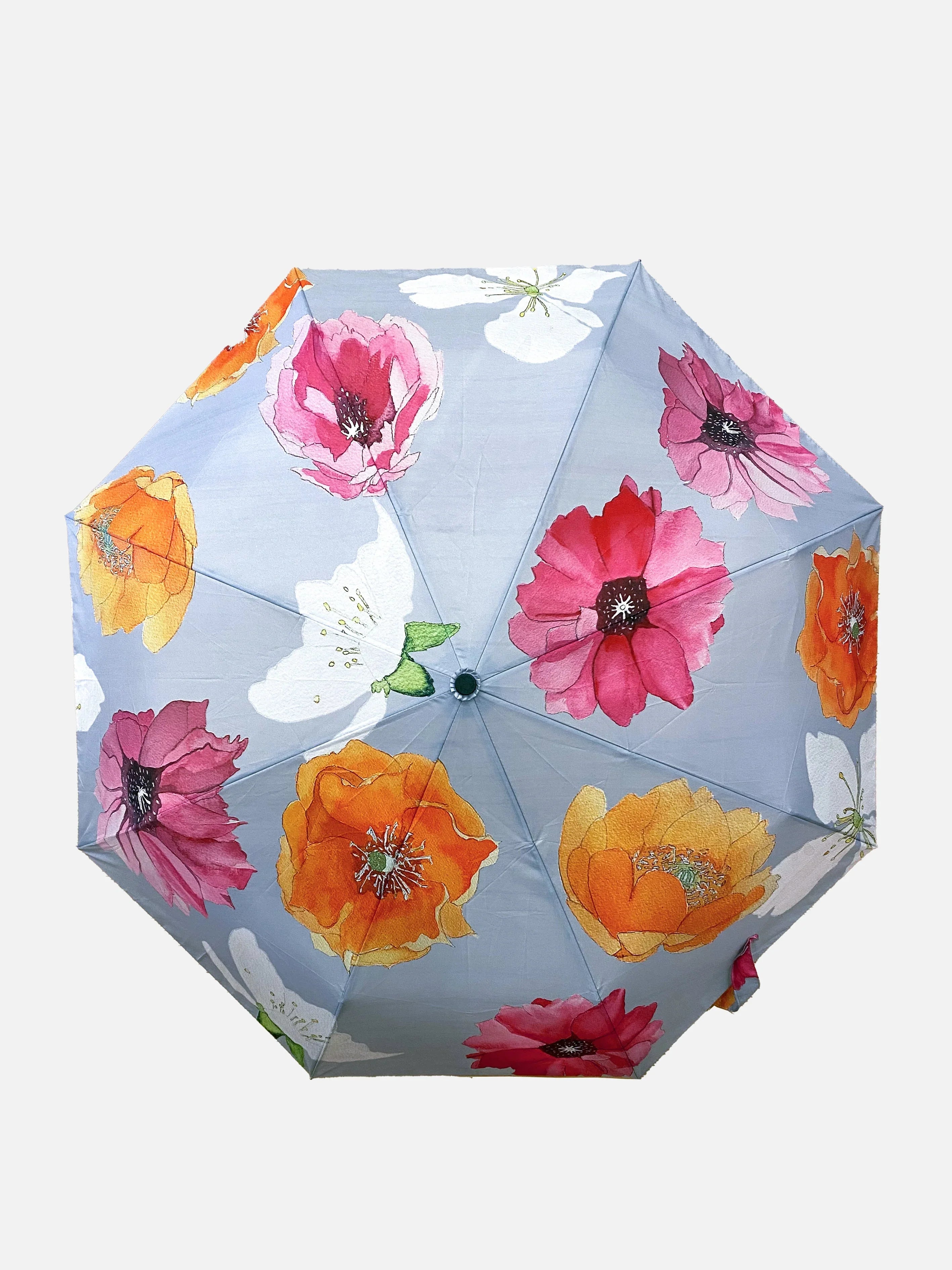 Light blue umbrella with large colorful floral print featuring orange, pink, and white flowers