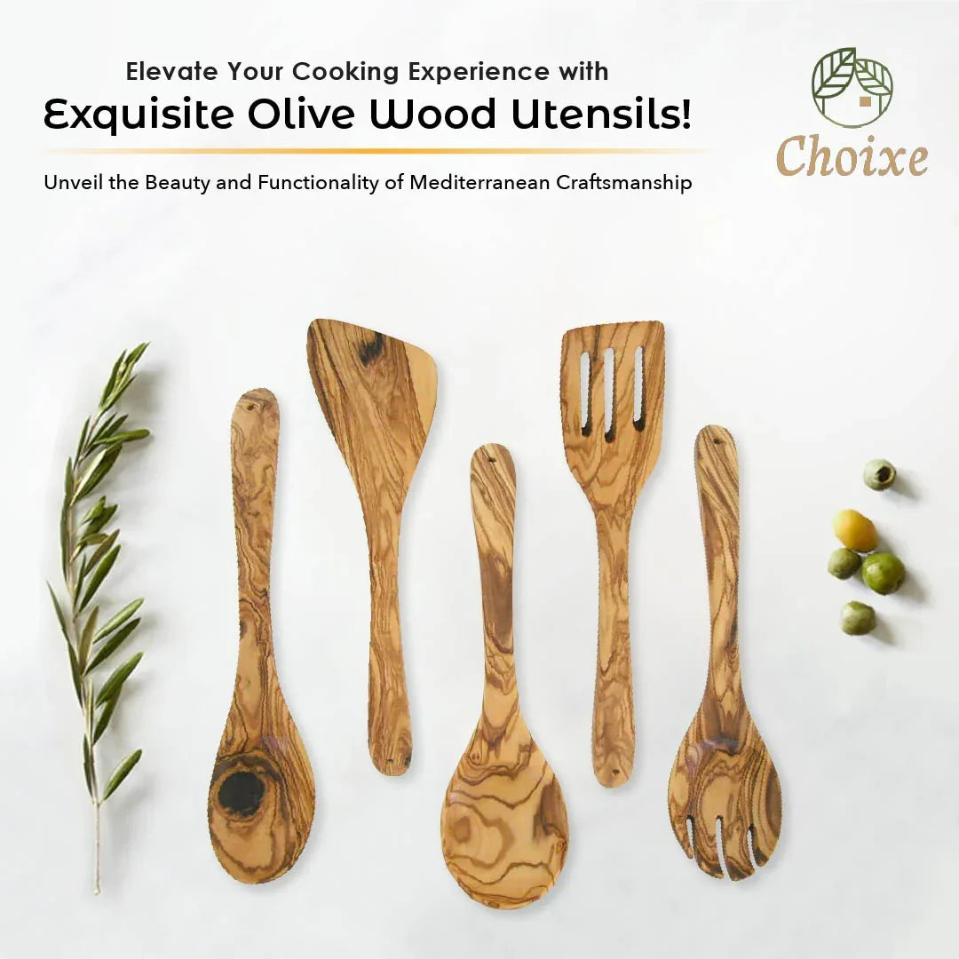 Set of five handmade olive wood kitchen utensils with distinctive grain patterns on white background