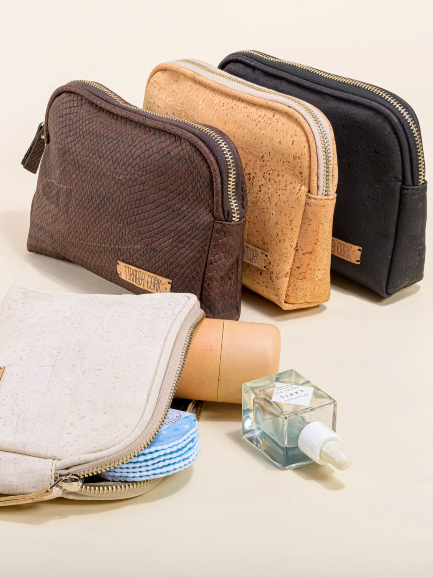 Sustainable cork cosmetic bags with beauty essentials, showcased at Qu!rk Boutique gift shop.