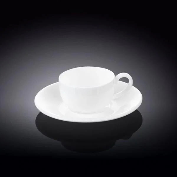 White ceramic cup and saucer on black background at Qu!rk Boutique