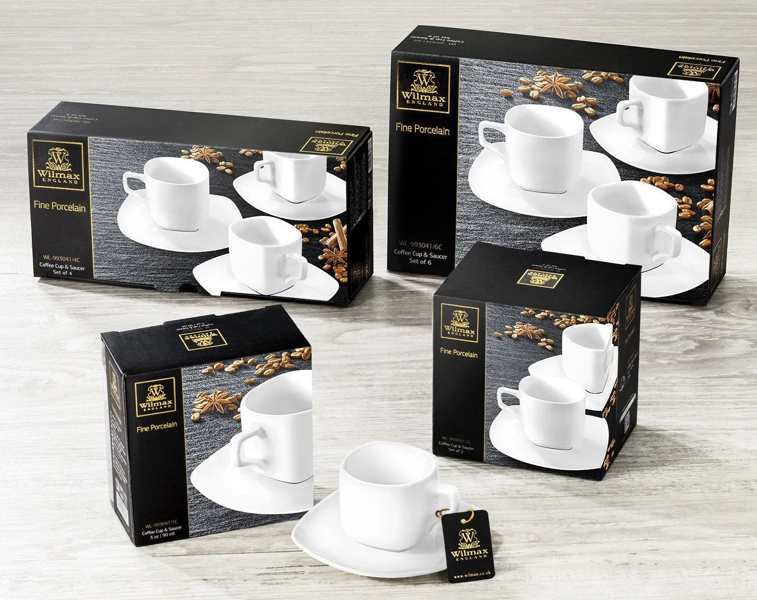 Wilmax fine porcelain coffee cup and saucer gift sets on wood table, perfect for Qu!rk Boutique.