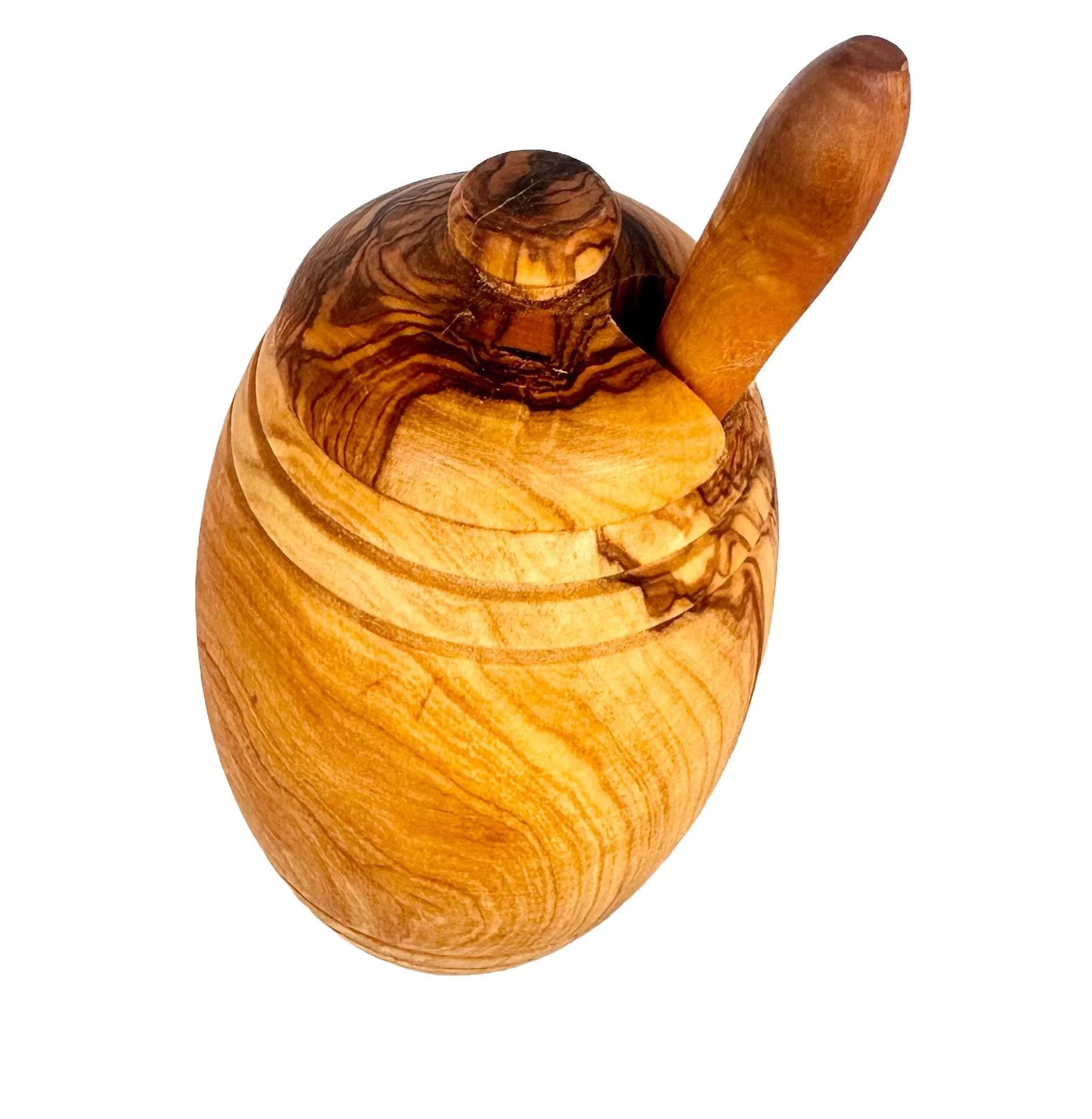 Handcrafted olive wood honey pot with lid and wooden dipper on white background