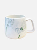 White ceramic mug with delicate white poppy flower design and green stems