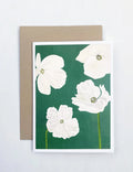 Notecard with white poppy flowers illustration on emerald green background, kraft envelope