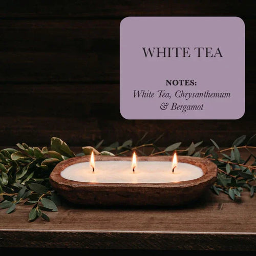 White tea scented candle in rustic wooden bowl with greenery, featuring floral notes, Qu!rk Boutique
