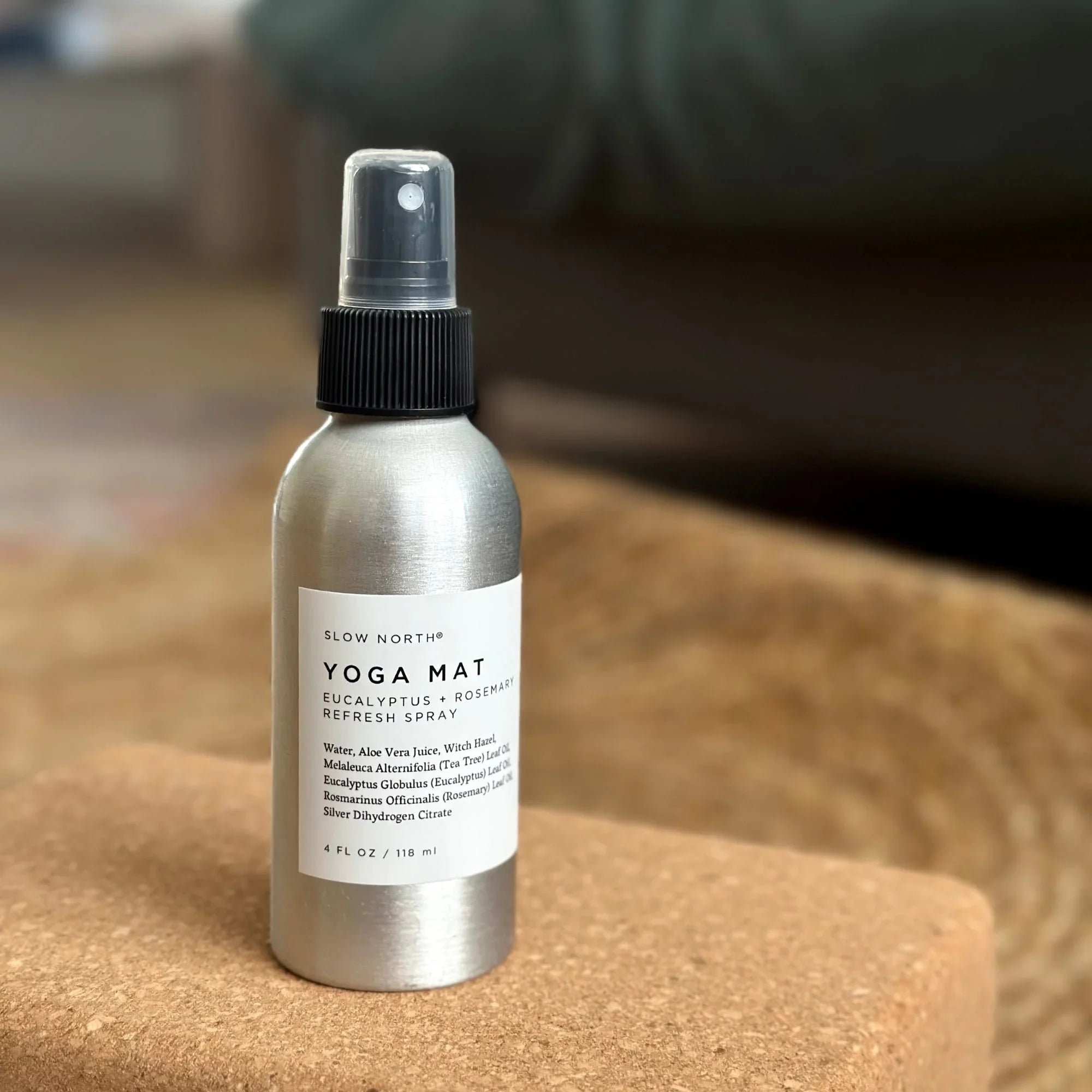 Slow North Yoga Mat Refresh Spray with eucalyptus and rosemary in aluminum bottle on cork yoga block