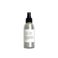 Silver spray bottle of Slow North Yoga Mat Lavender Lemon Refresh Spray on white background