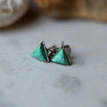 Turquoise triangle stud earrings with silver trim on neutral background, Qu!rk Boutique jewelry