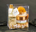 The Grecian Soap Company gift set with almond goat's milk soap, amaretto bath & body scrub, sponge, and lotion in clear box