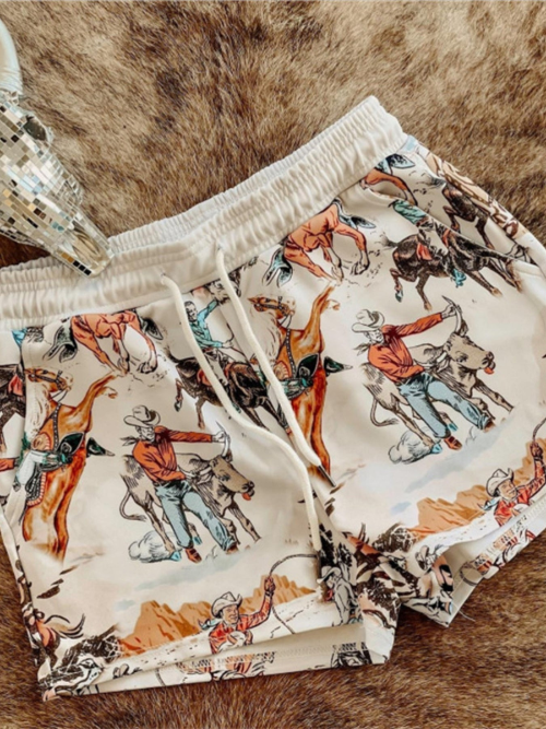 Shorts with cowboy print on a brown fur background