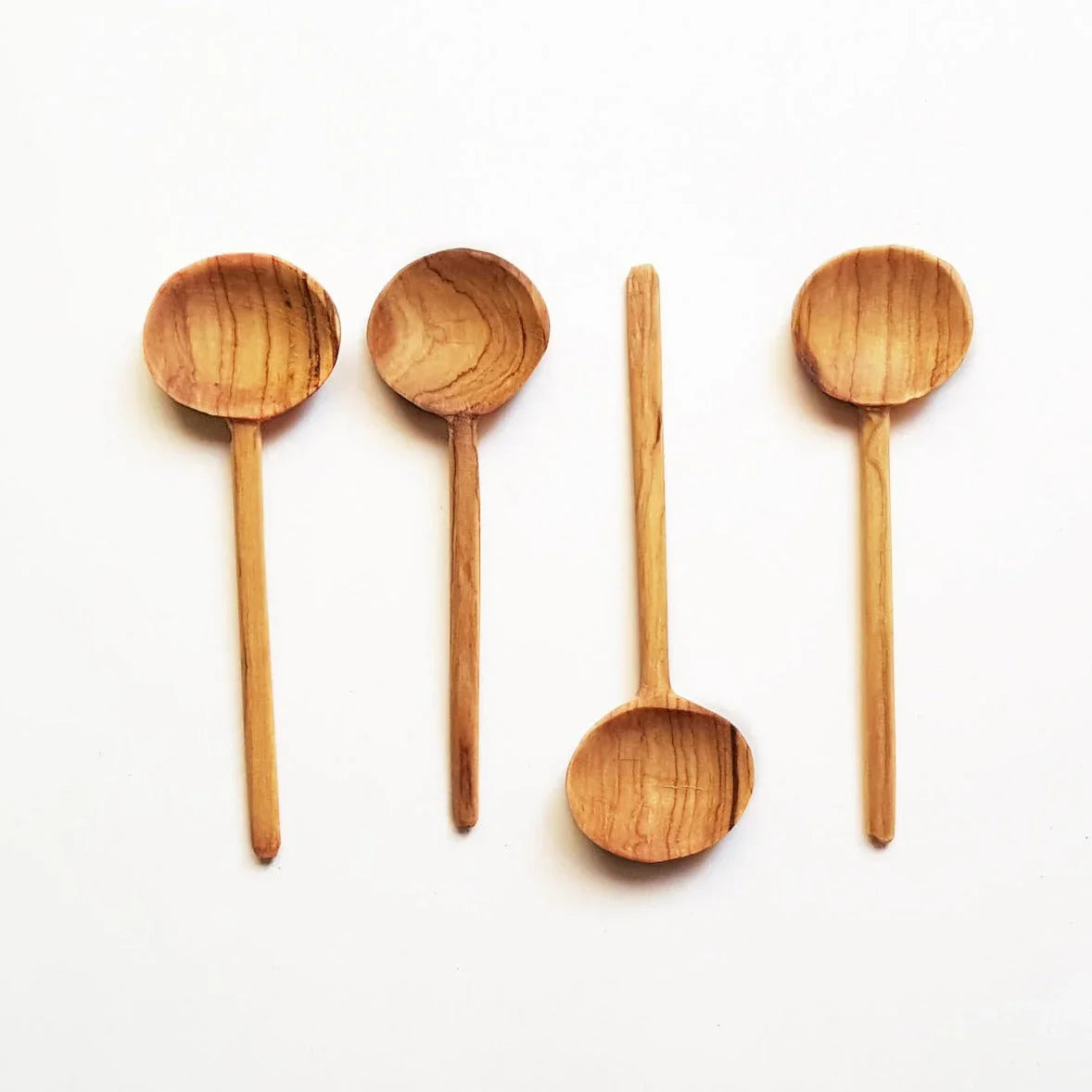 Handcrafted wooden spoons set on white background, sustainable kitchen gift at Qu!rk Boutique