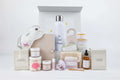 All-natural lavender skincare gift basket with eye mask, water bottle, candles, bath salts, belly oil, and exfoliating products
