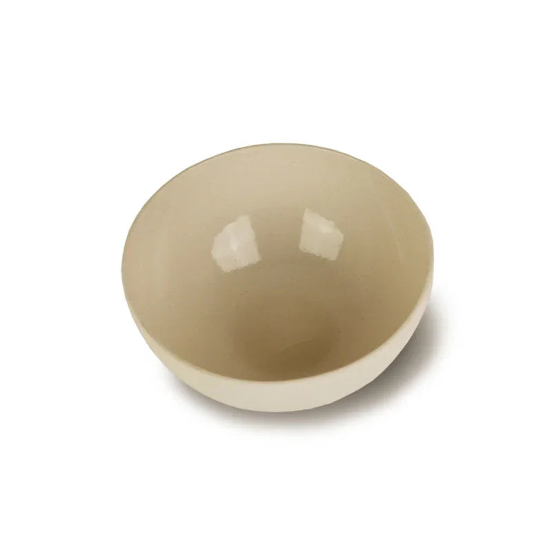 Minimalist beige ceramic bowl on white background, artist-designed giftware from Qu!rk Boutique