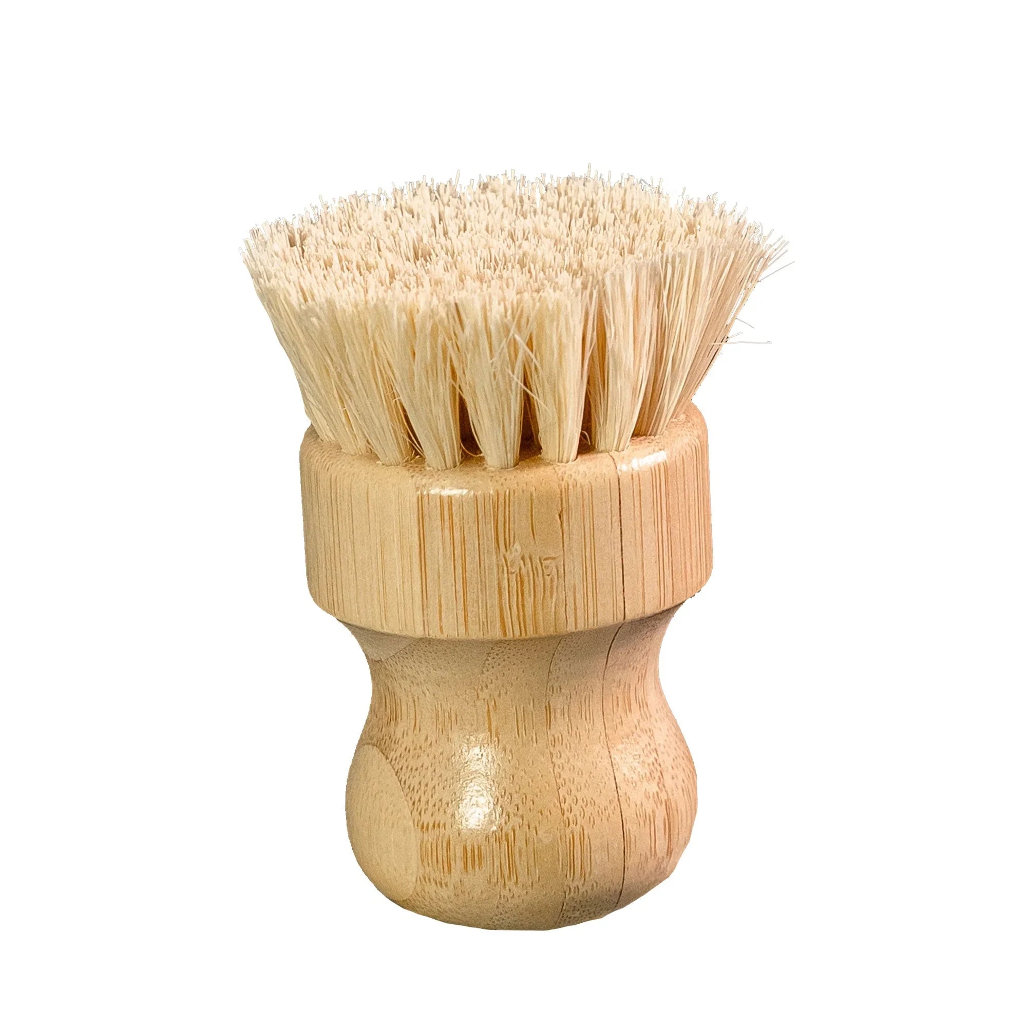 Close-up of a bamboo dish scrub brush with dense natural bristles on white background