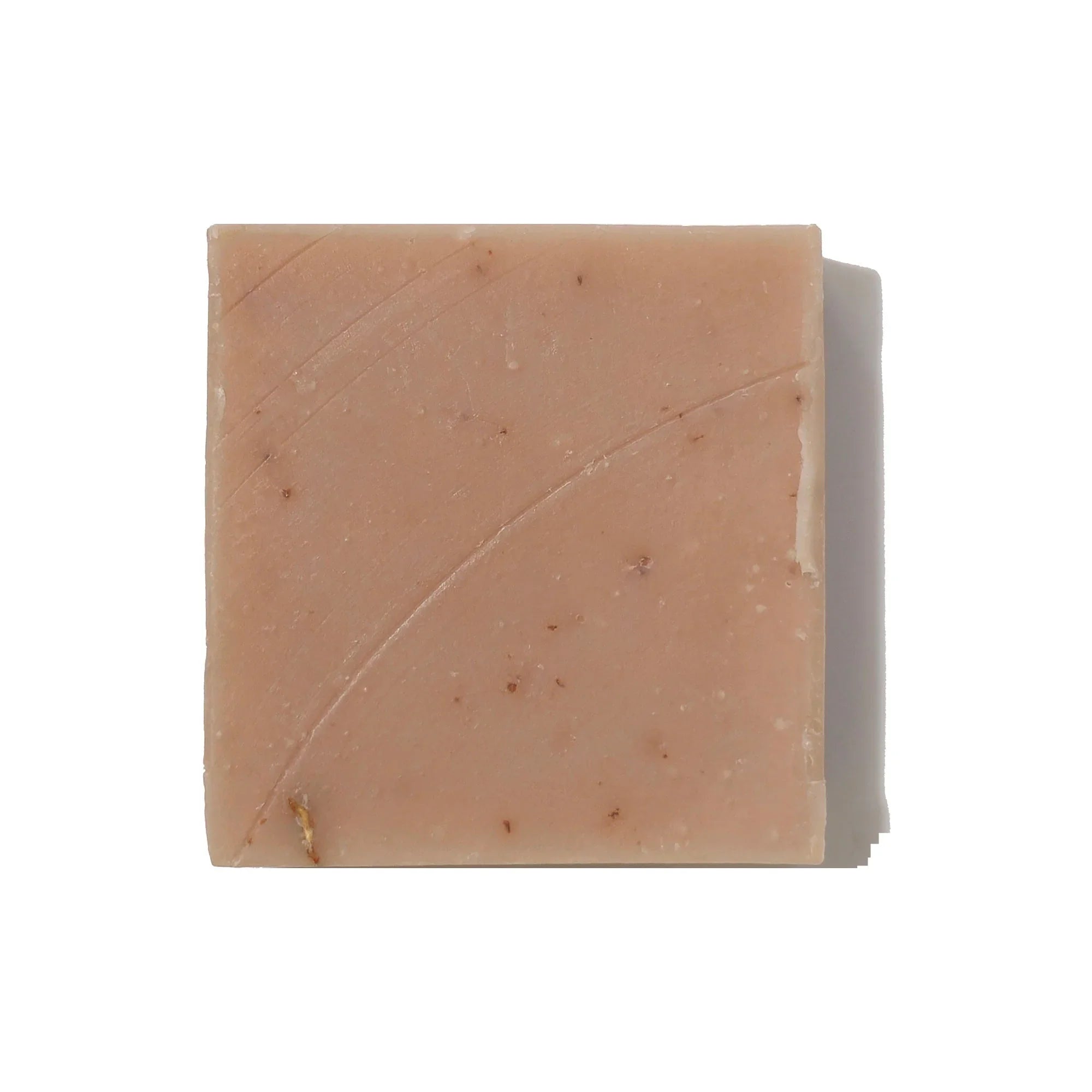 Natural artisan bar soap for face and body on white background, available at Qu!rk Boutique.