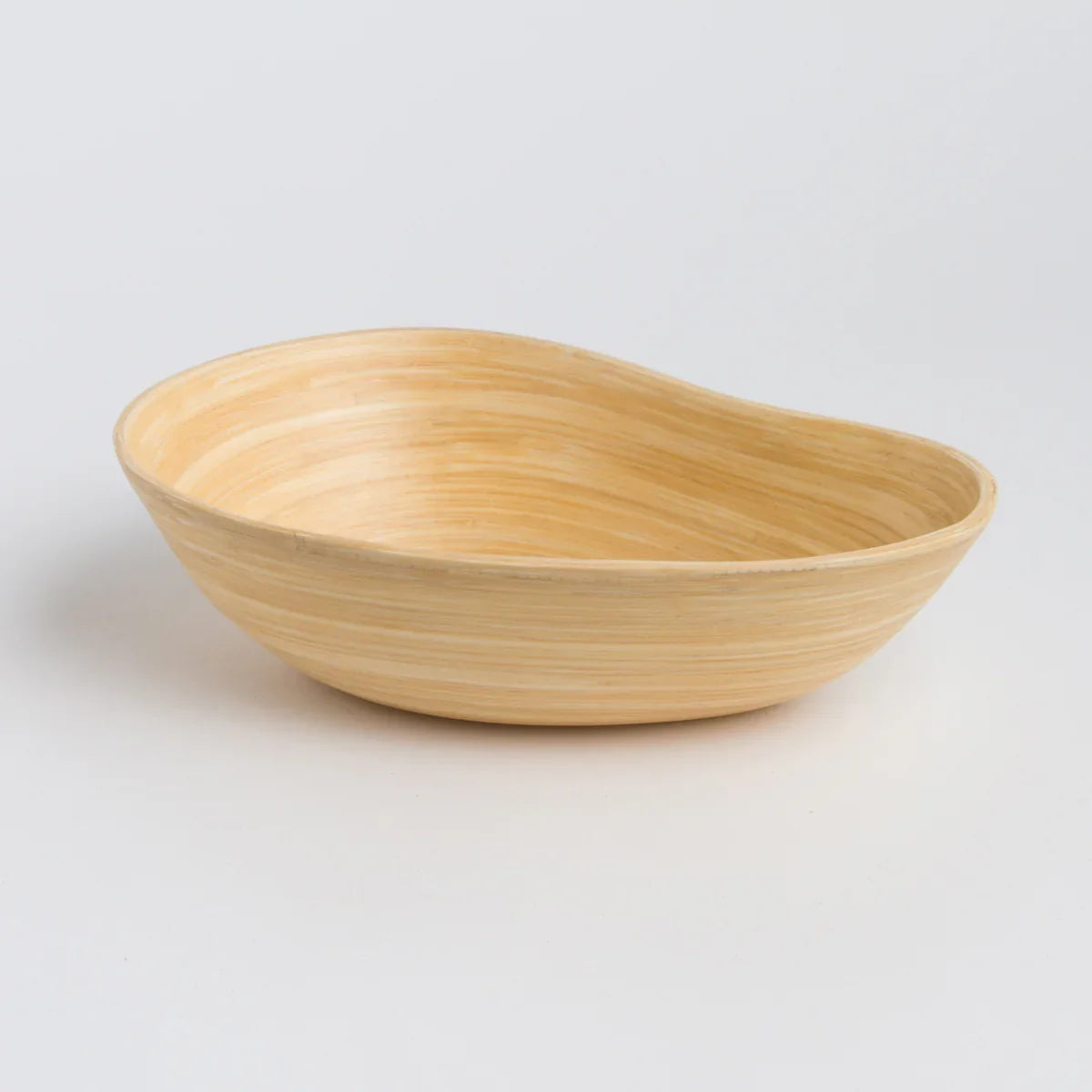 Eco-friendly bamboo bowl with organic shape on white background, Qu!rk Boutique gift