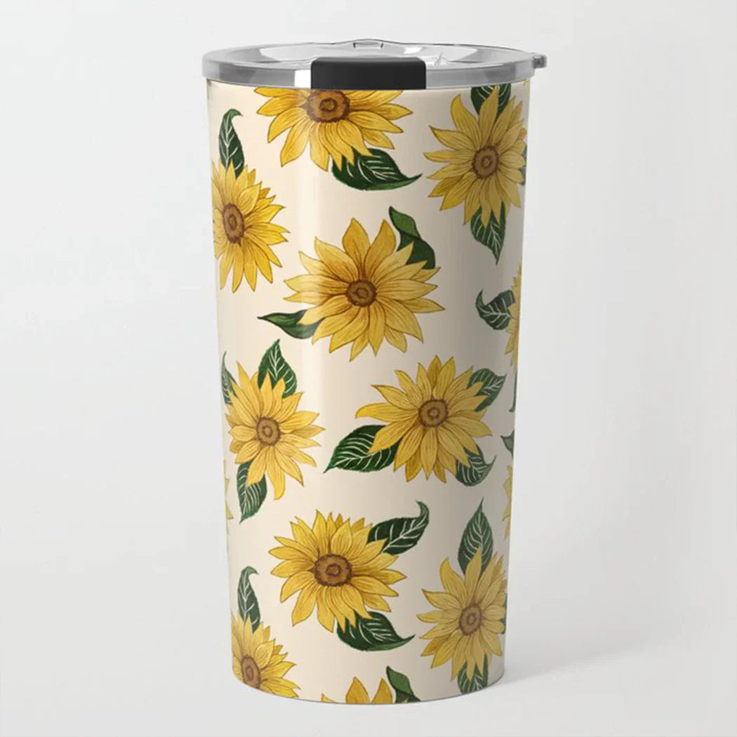 Cream-colored travel tumbler with bright yellow sunflower and green leaf pattern, stainless steel lid
