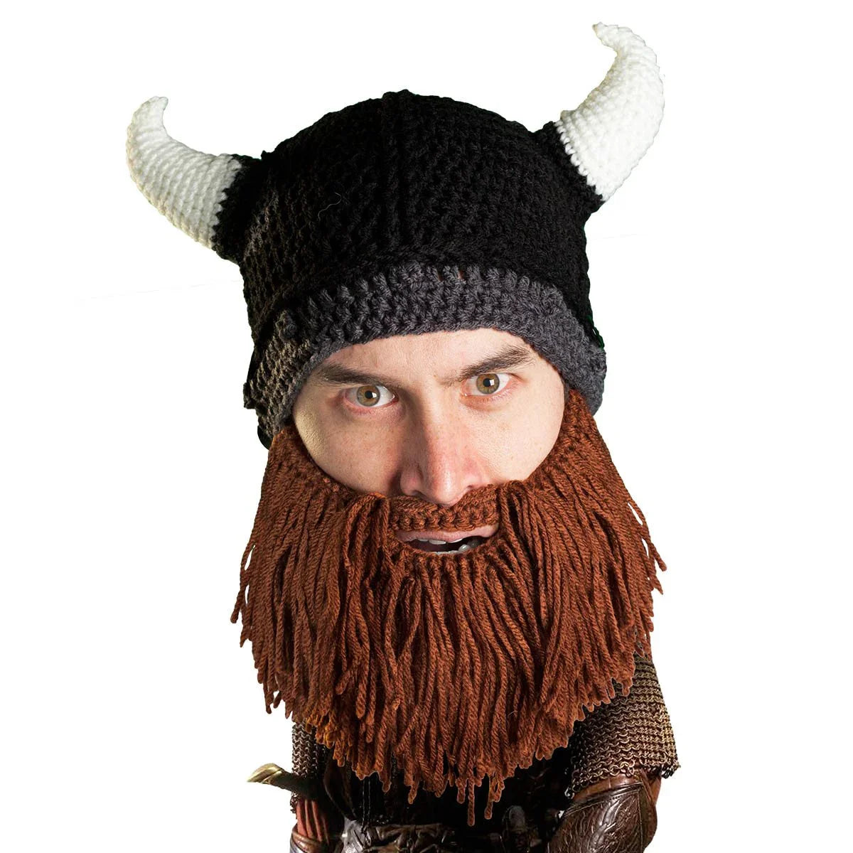 Man wearing a black crocheted Viking hat with white horns and a brown yarn beard