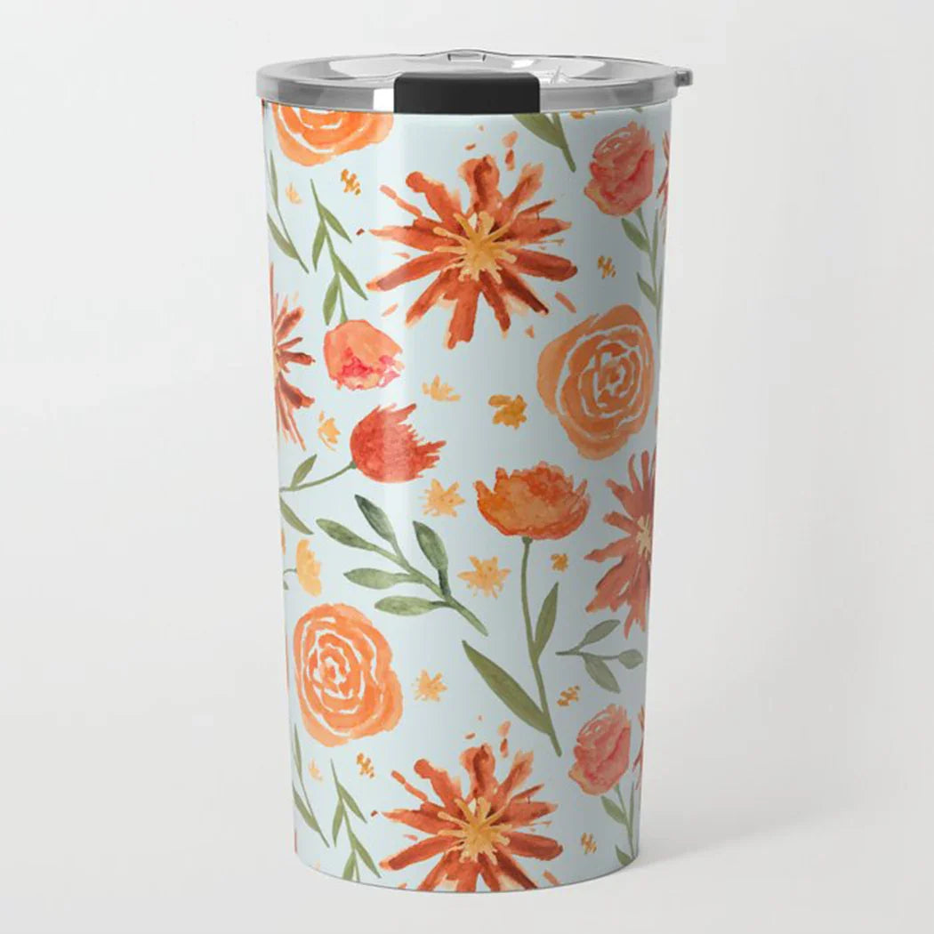 Stainless steel tumbler with orange and yellow watercolor floral design on pale blue background