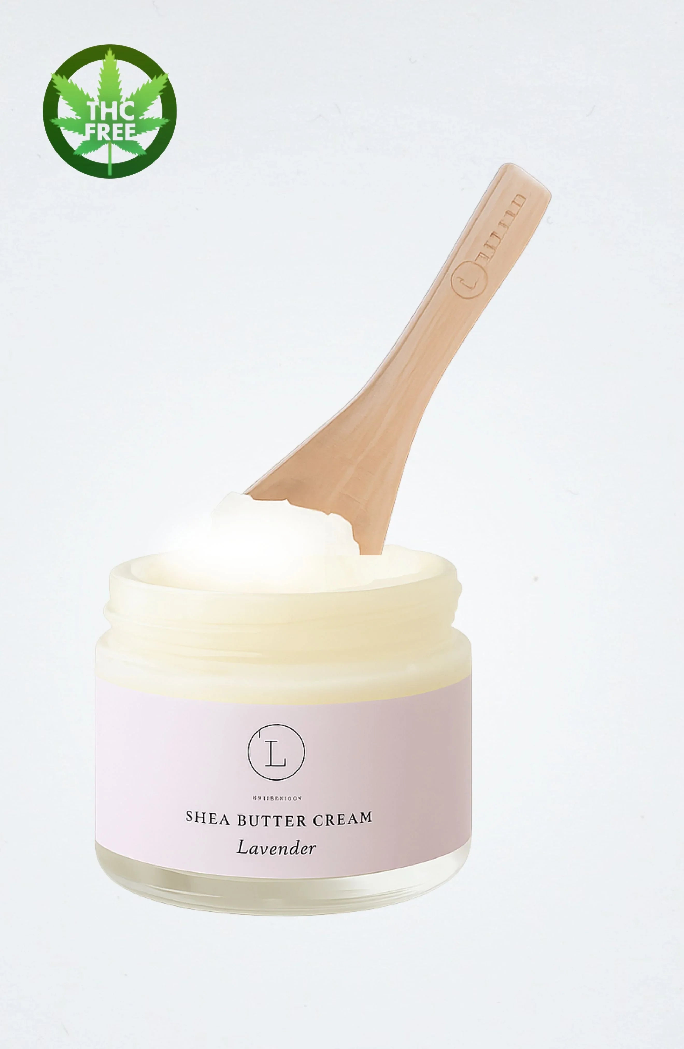 Open jar of lavender shea butter cream with wooden spatula and THC free label