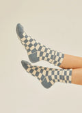 Blue and cream checkerboard crew socks on feet, sustainable fashion at Qu!rk Boutique