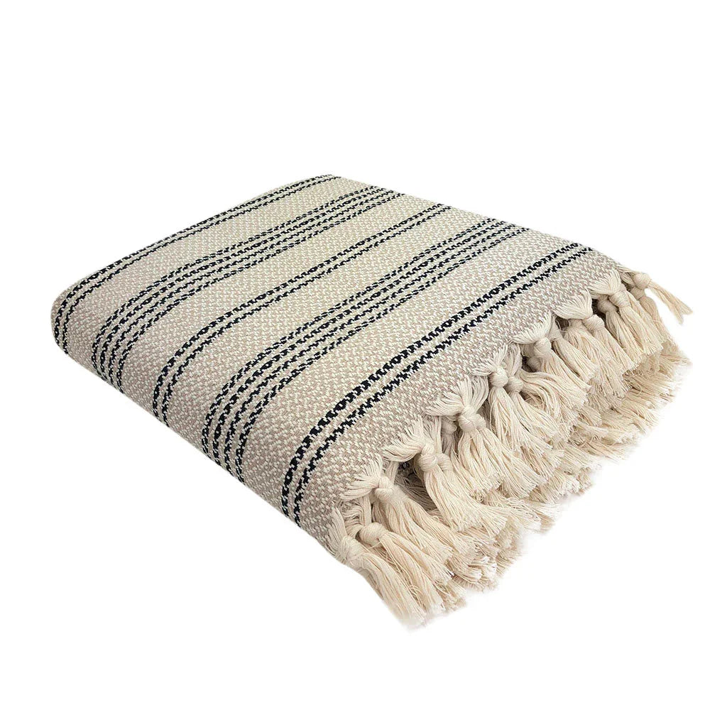 Folded cream Turkish throw blanket with black stripes and fringe, Qu!rk Boutique