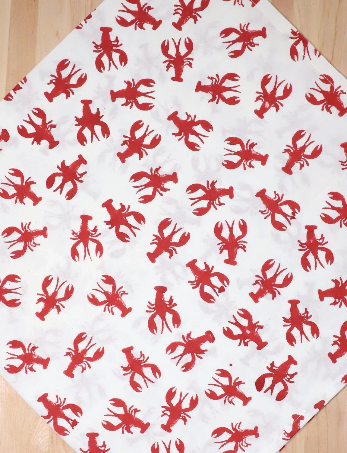 White cotton tea towel with red crawfish print, artist-designed kitchen textile