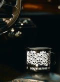 Black enamel mug with white skull graphic and 'Death Before Decaf' text by Qu!rk Boutique