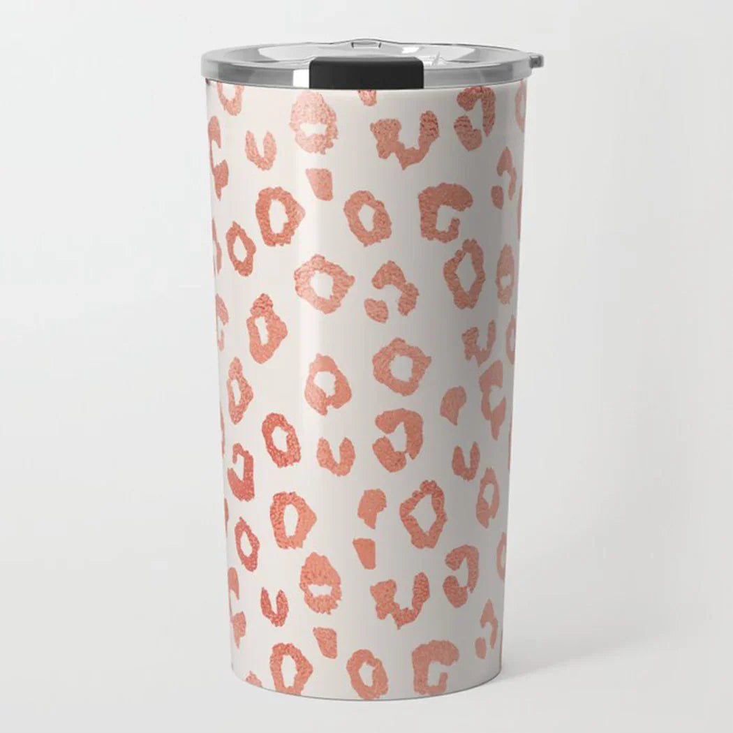White travel tumbler with rose gold leopard print pattern and silver lid
