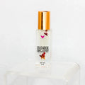 Rose Glow perfume oil with gold cap and rose petals, Qu!rk Boutique gift, 5ml bottle