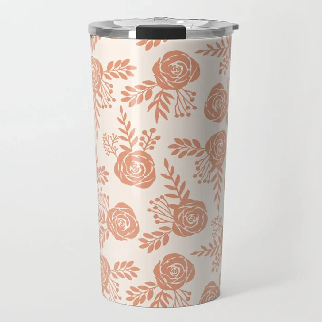 Cream-colored travel tumbler with terracotta floral rose pattern and silver lid