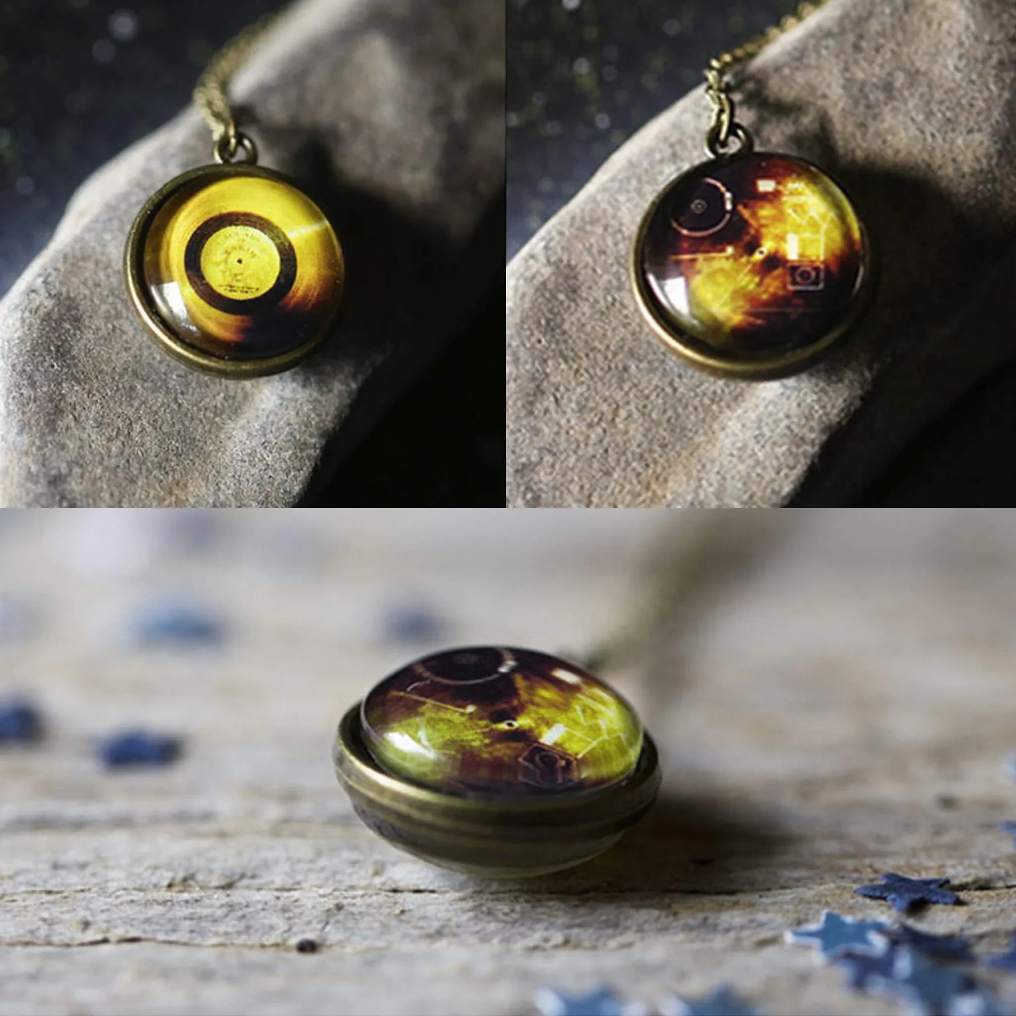 Vintage brass pendant necklace with amber and dark yellow glass dome on stone and wood surfaces