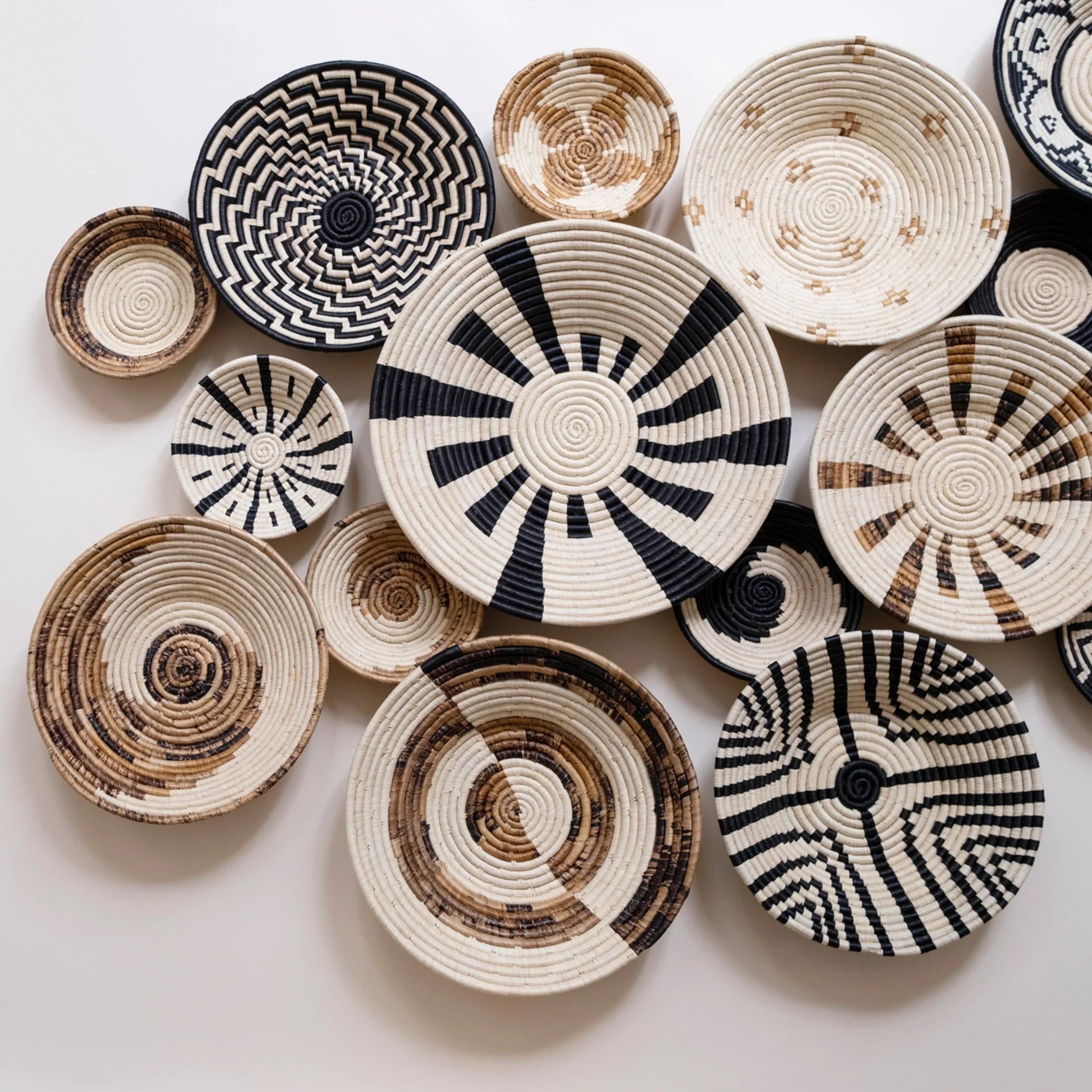 Ethically sourced woven baskets with bold black and natural patterns on display at Qu!rk Boutique