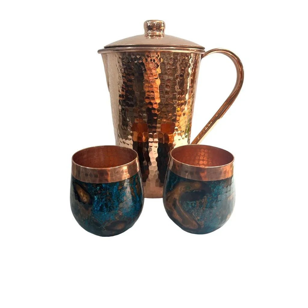 Hammered copper pitcher with lid and two blue patina copper cups, artist-designed gift set.