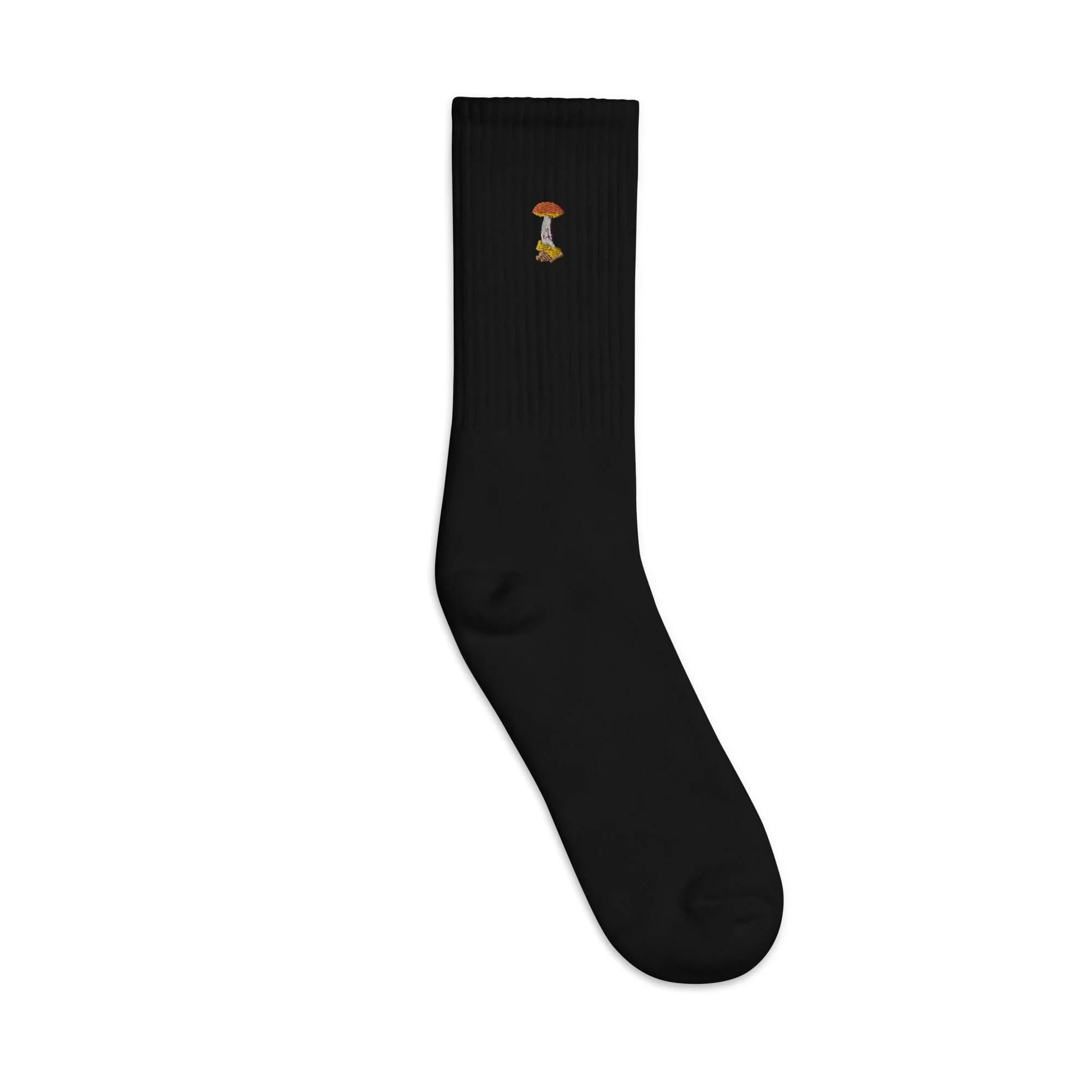 Black crew sock with small embroidered orange and yellow mushroom design on ribbed cuff