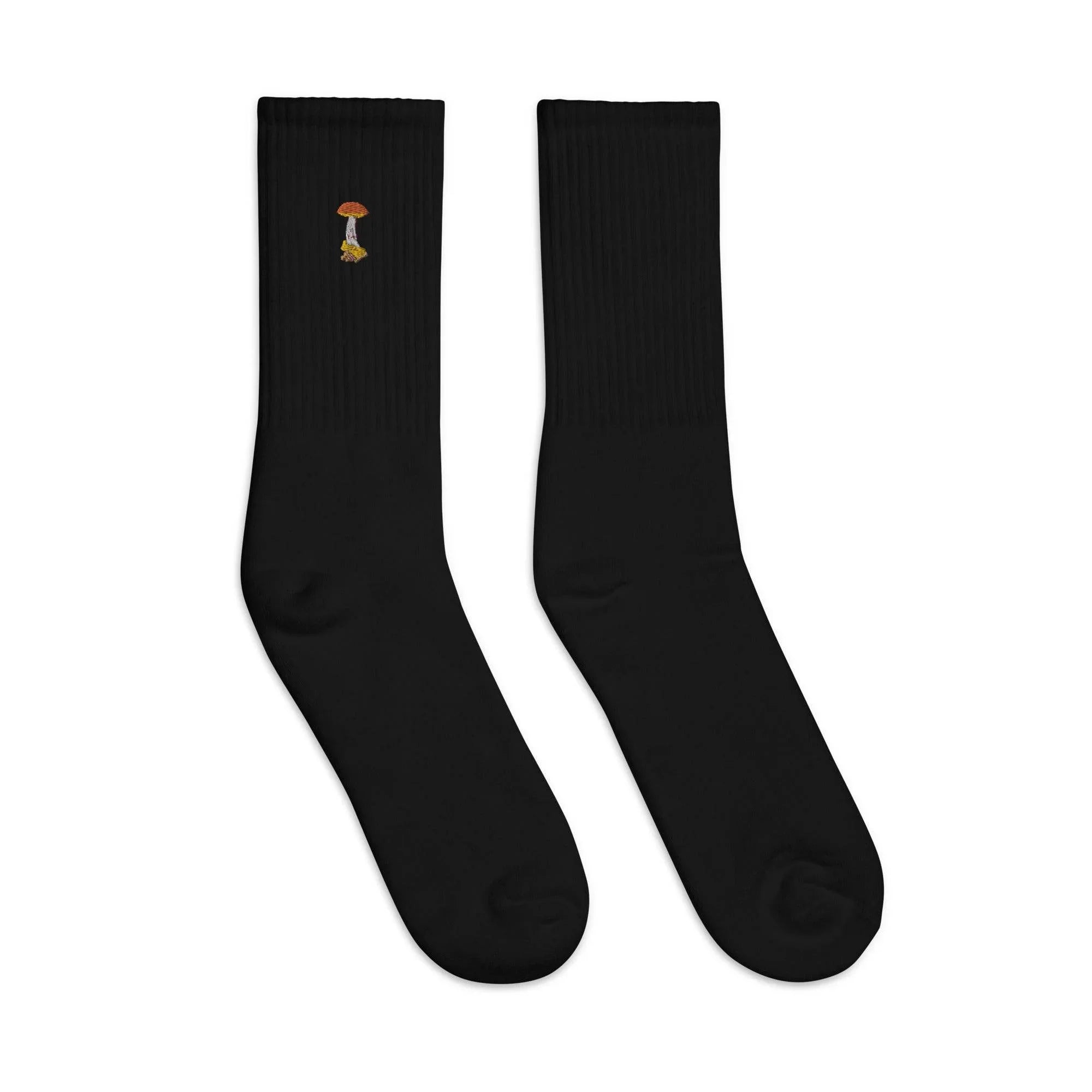 Black crew socks with small embroidered orange mushroom and yellow detail on ribbed cuff